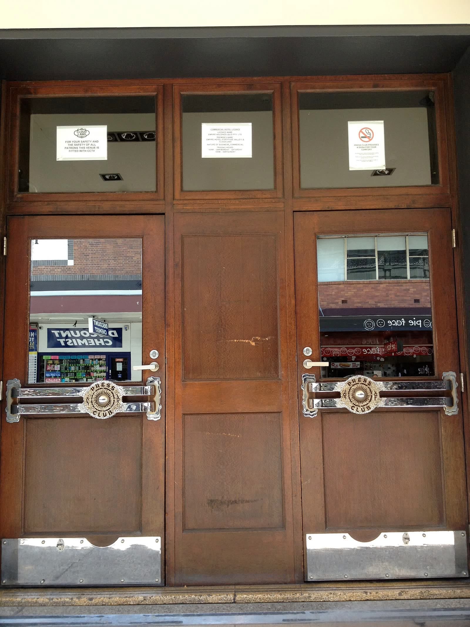 Dark timber entrance door at the Empire Hotel Press Club, Fortitude Valley, Brisbane